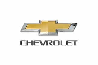 Chevrolet logo featuring a gold bowtie emblem with silver edges and the brand name below.